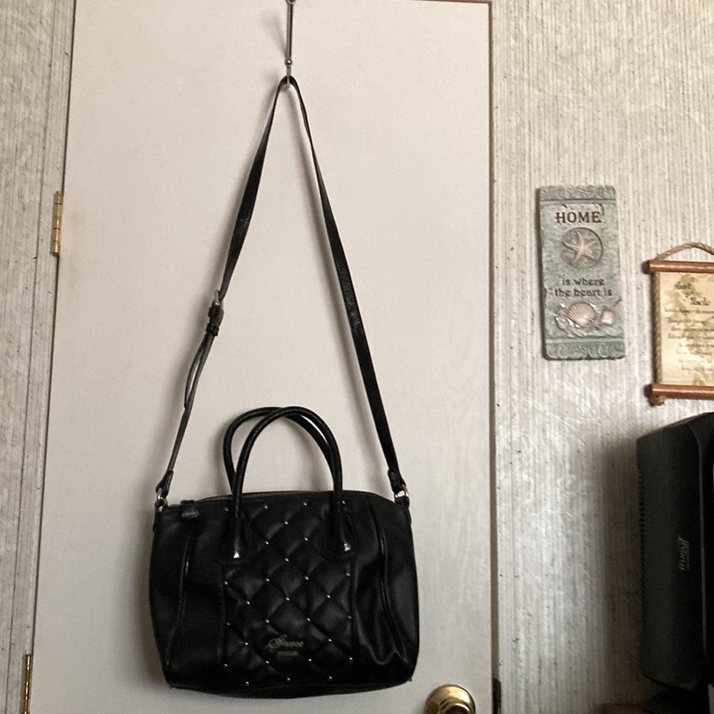 Beautiful purse, black with silver, hand out shoulders.